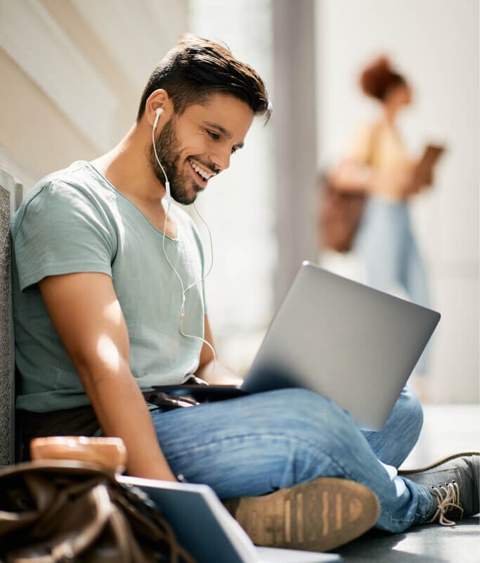 Happy College Student Learning While Using Laptop 2023 11 27 04 48 59 Utc 683x800