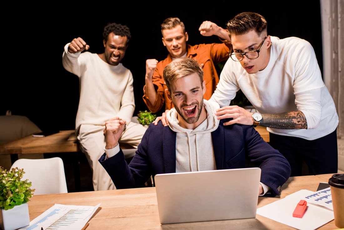 Happy Multicultural Businesspeople Showing Winner RUJHP8N